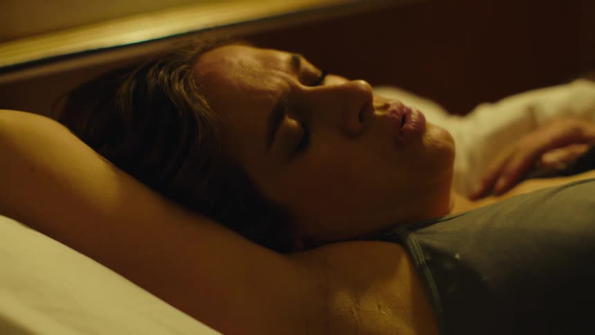 Portrait of a woman lying down taking deep breaths