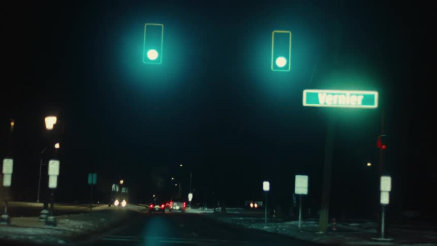 Car moving on a road at night