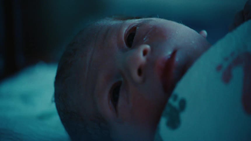 Portrait of a newborn baby lying down
