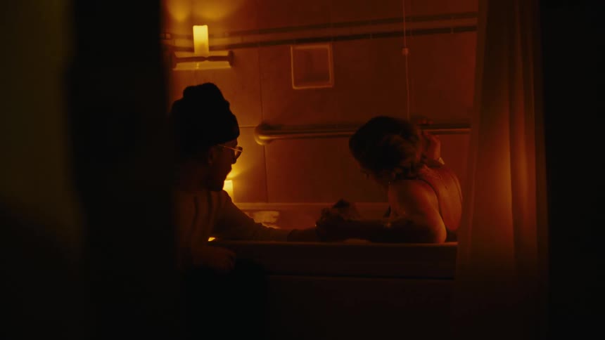 A woman is laboring in a birth pool at a hospital