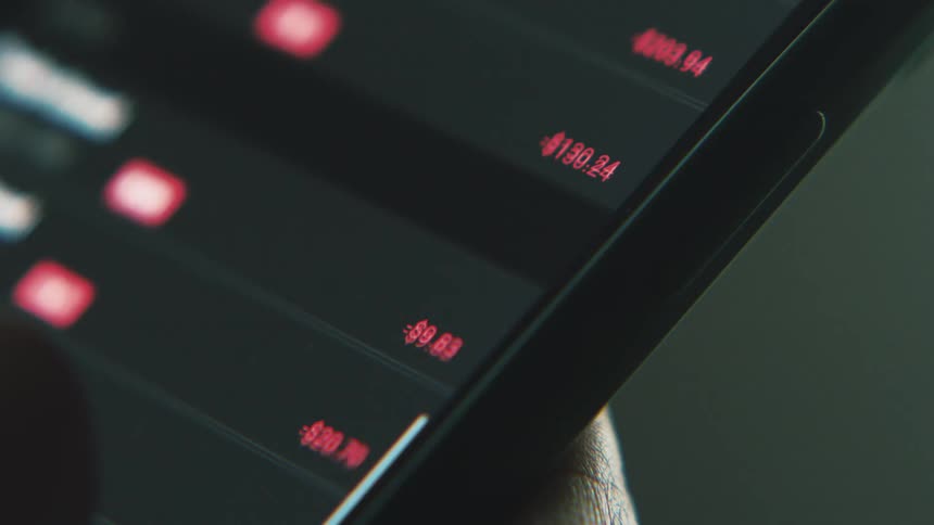 A person scrolls on their phone