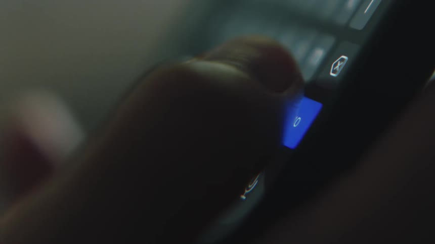 A close up of a person using their cell phone scrolling on the screen