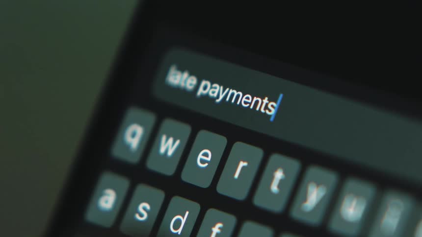 A person types a phrase into their phone