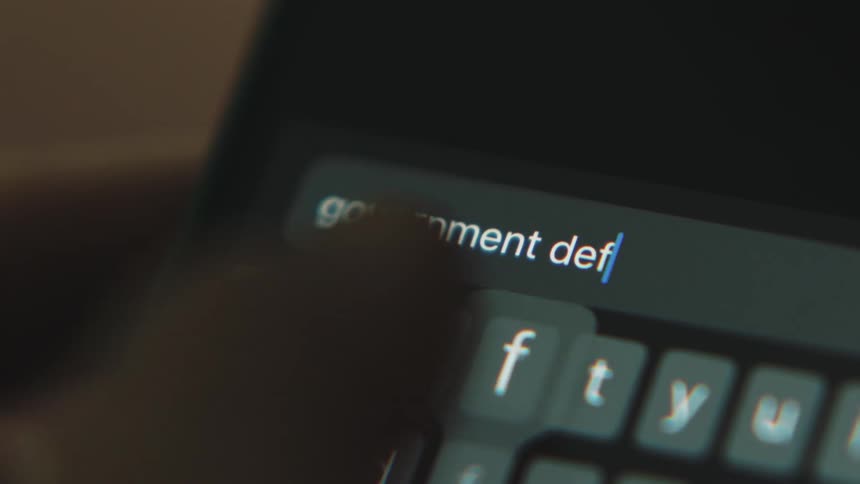Aperson is typing on their phone