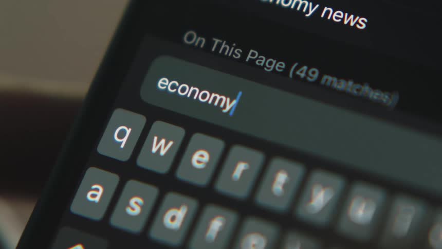 A person types on their phone screen to conduct a search