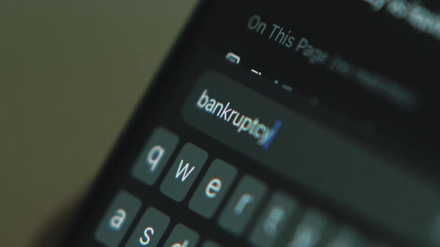 A person types a search word on their phone