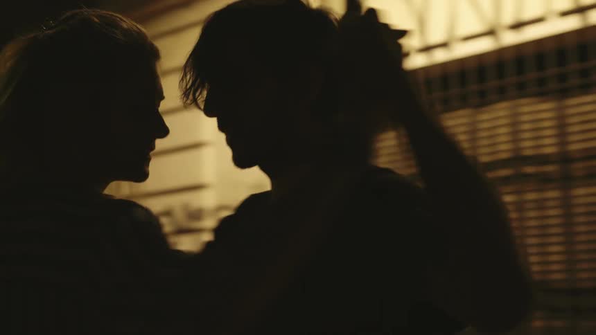 A couple dancing the tango on the city streets at night
