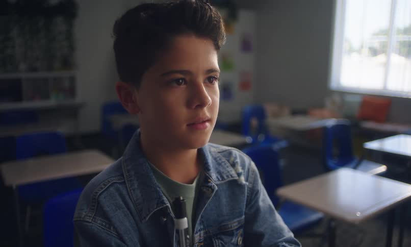 A kid thinks tapping a marker to his chin