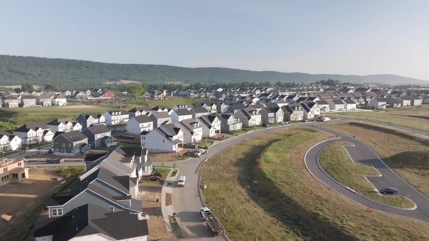 A place with many identical houses around a partially circular street