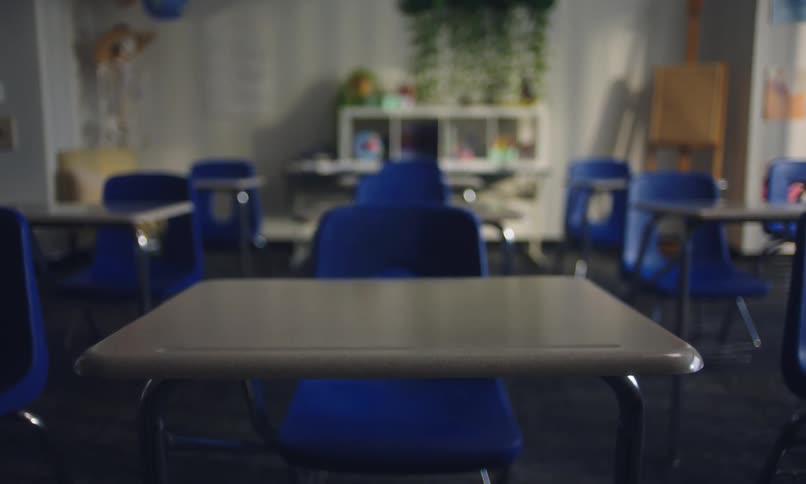 A zoom in on a desk in a classroom