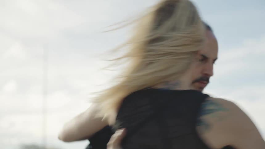Woman and man performing tango dance in a public space
