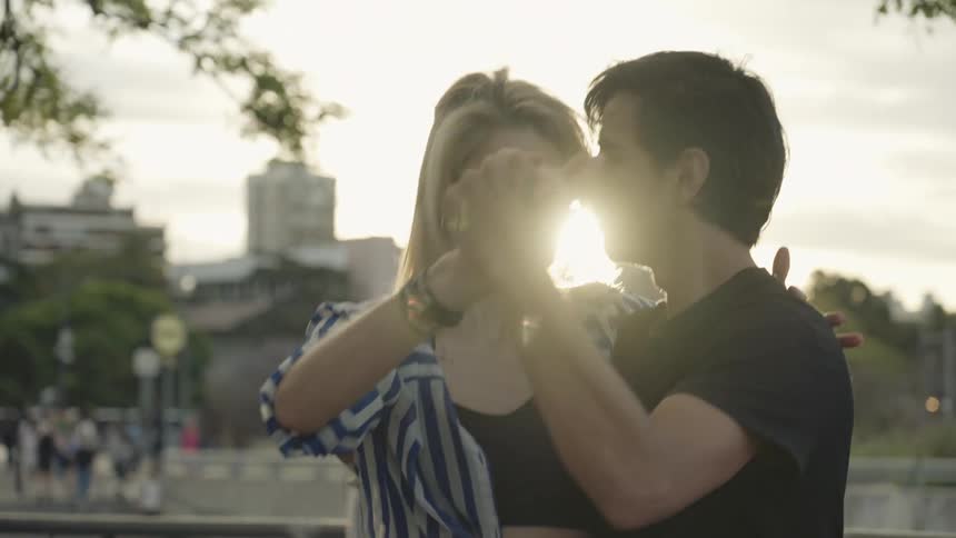 Man and woman in an open space dancing tango