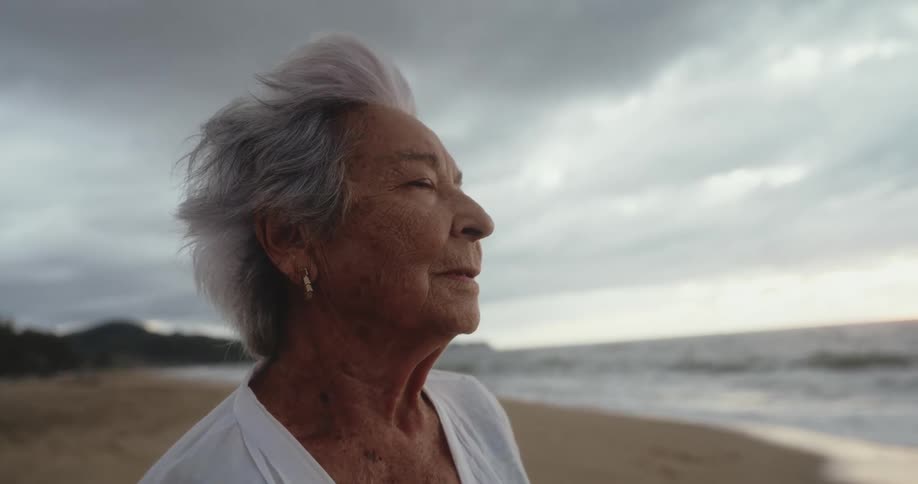 Portrait of an elderly lady on the beach