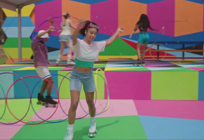 A colorful outdoor skating rink with people on roller skates a whimsical atmosphere of fun and carefree lifestyle