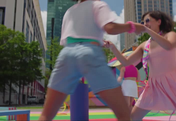 Group of people rollerblading on a colorful playground