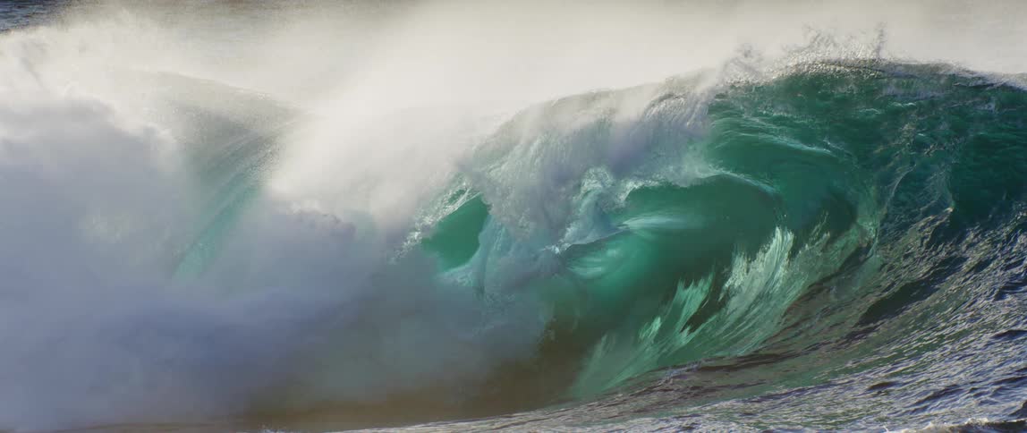 Closeup of a crashing ocean wave in slow motion