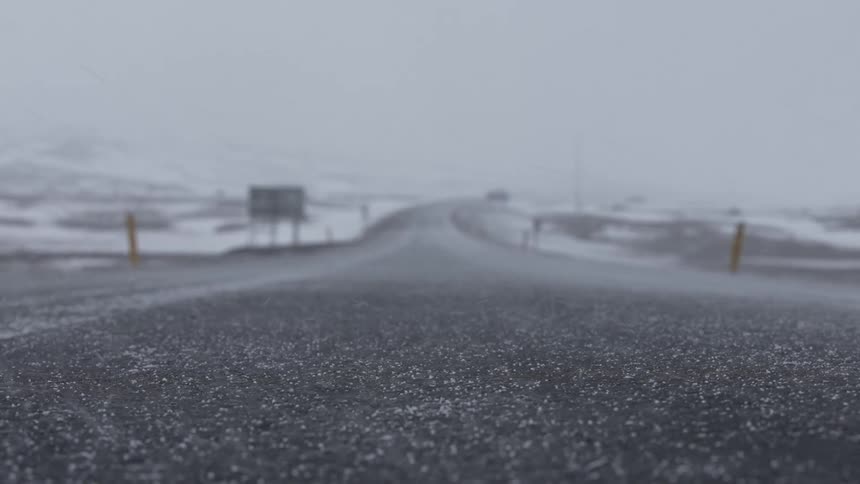 Heavy snow is falling on the road