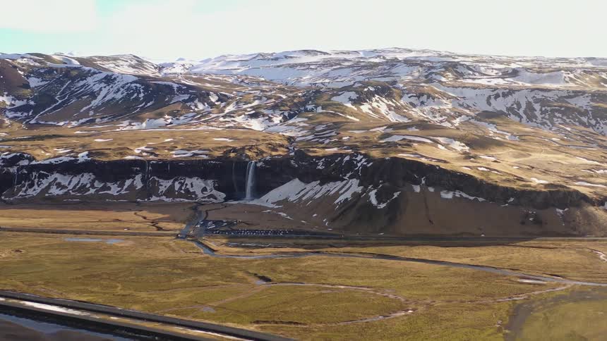 Aerial panorama of mountains and rivers winding through the snowcovered landscape