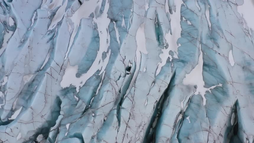 The sold ice covers the ground below