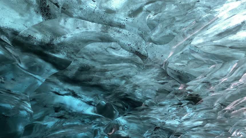 Frozen cave with abstract patterns and falling water drops