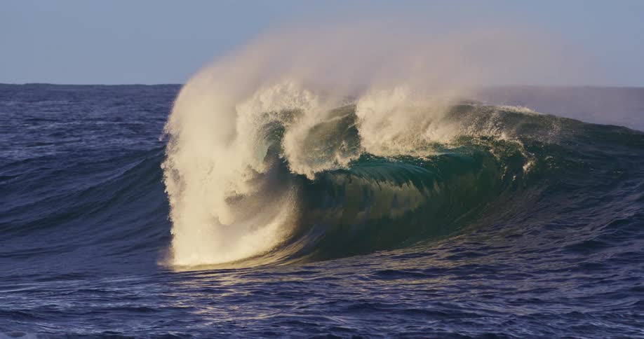 Ocean landscape with a wave forming and breaking strongly