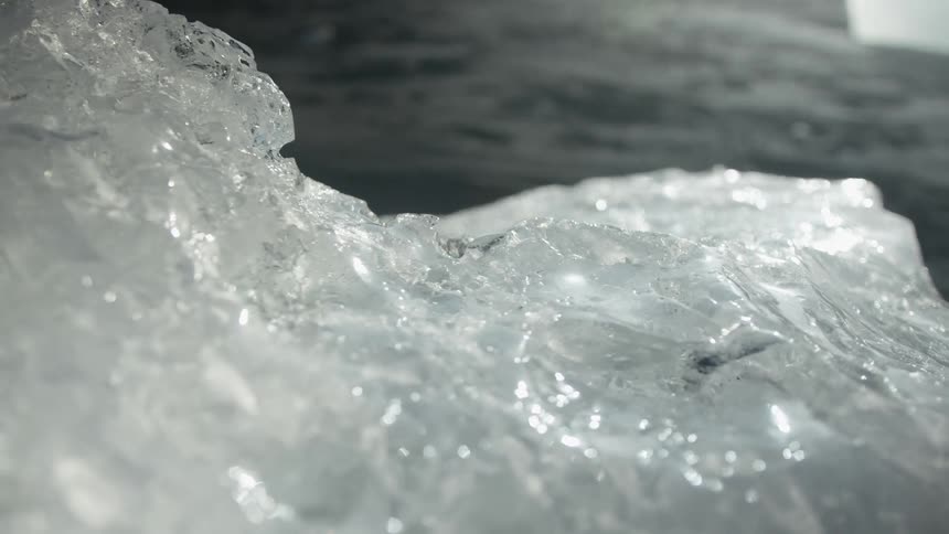 A piece of white ice with its shiny surface