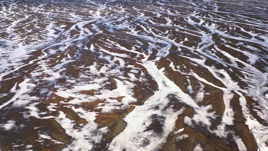 The landscape is covered with ice