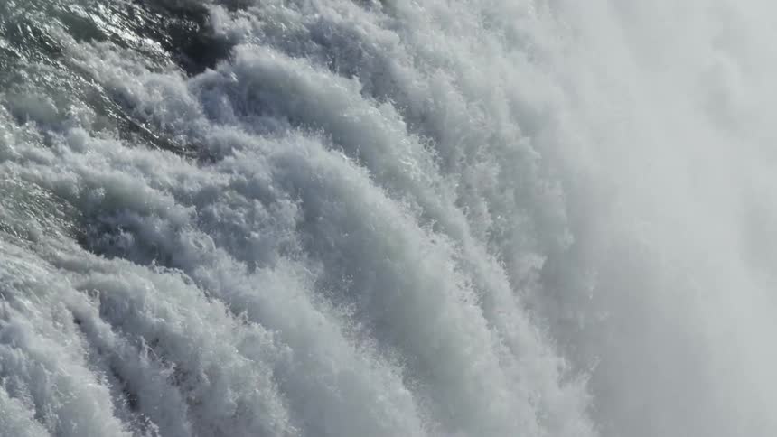 River in free fall in a strong and foamy waterfall