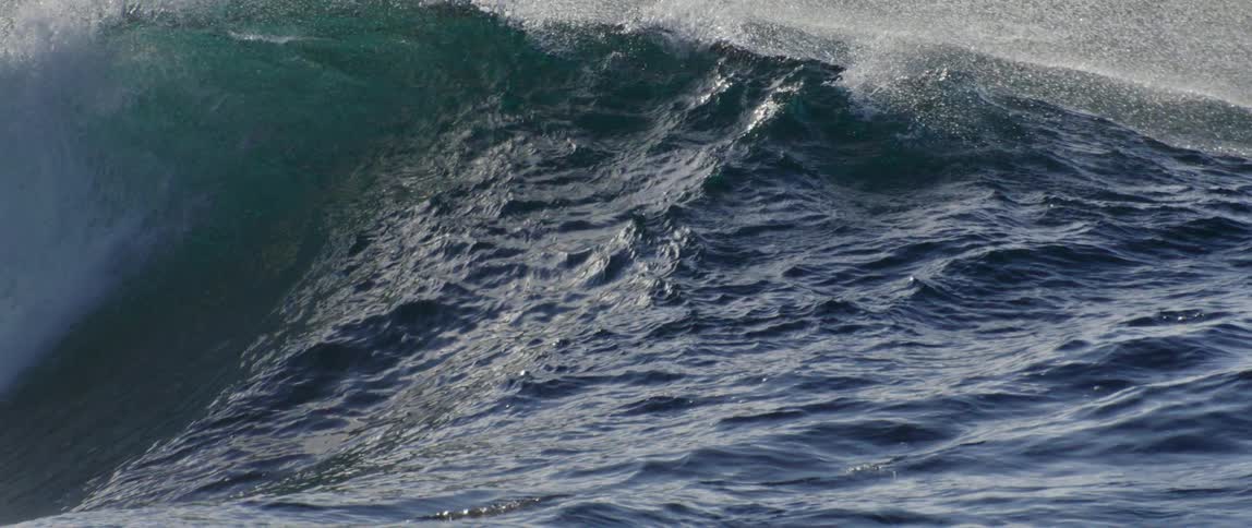 The ocean water is rough with large waves