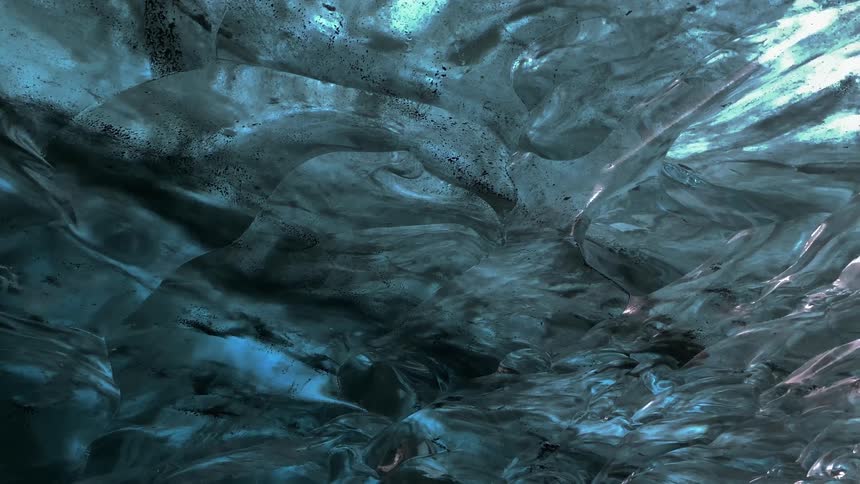 Interior of an ice cave with a translucent blue hue