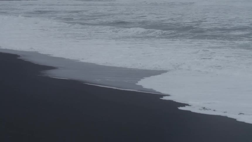 The waves crash on the shore