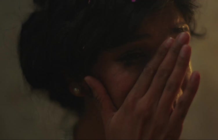 Close up of the face of a sad woman crying