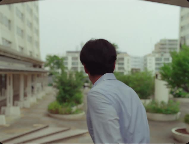 Man with scared facial expression walking looking to the sides