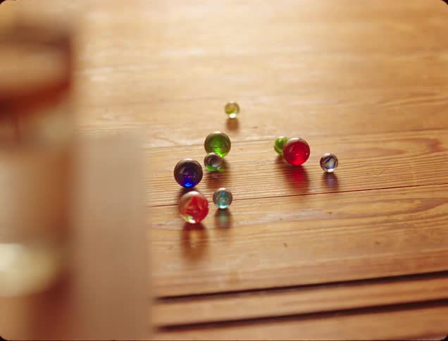 Marbles on a wooden surface