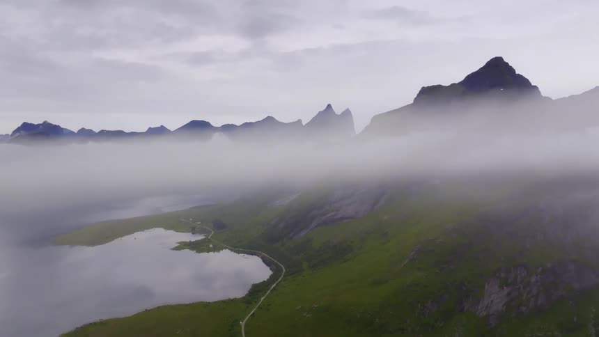 The mountain peak is above the clouds