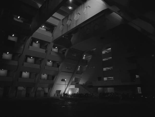 Person with an illuminated body walking in a condominium at night