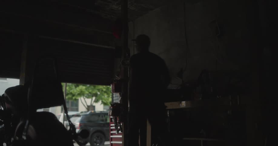 A man closes up his mechanic shop