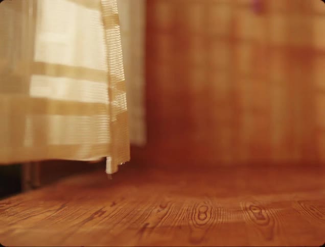 Curtains are waving in the wind at night