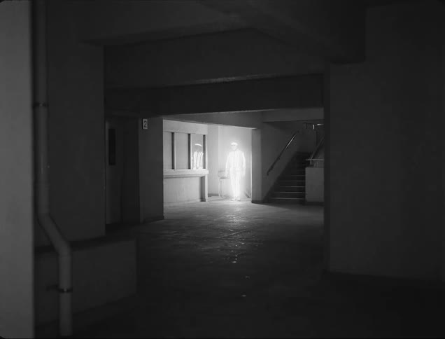 A glowing man enters the room