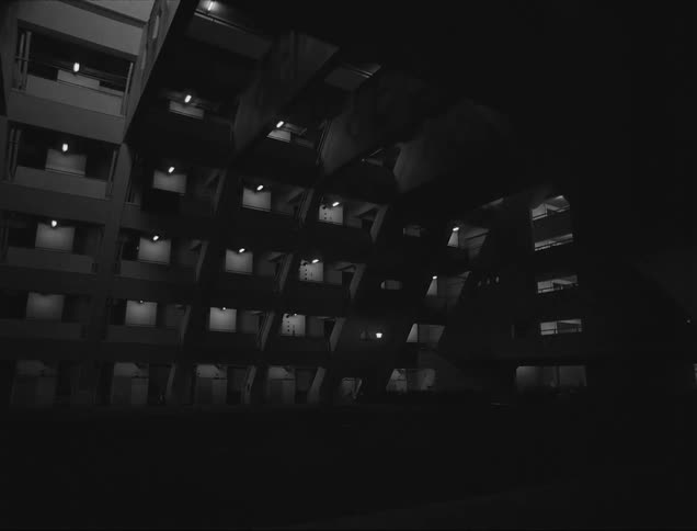 Interior view of a condominium with apartment blocks lit up at night