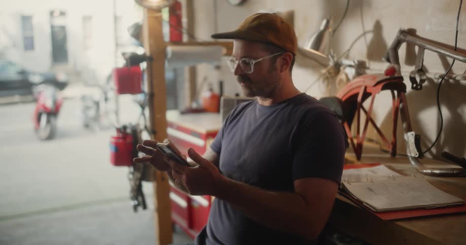 A man is looking at his cell phone
