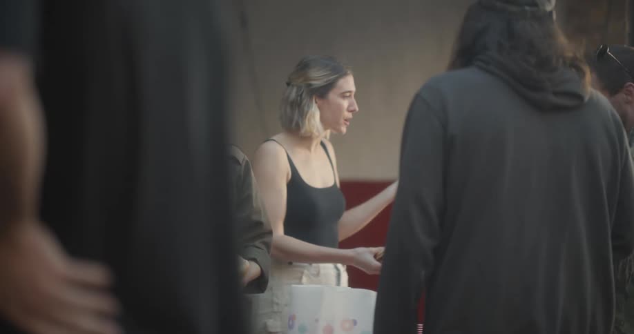 Friends chatting happily while eating burgers