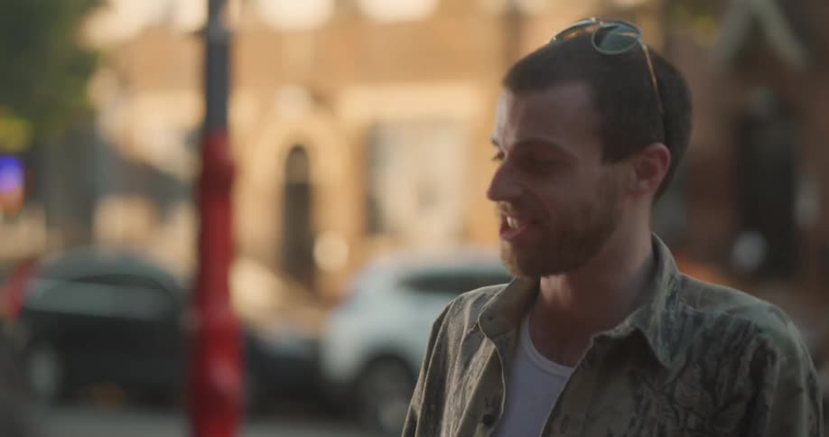 Portrait of a man talking with other friends in an outdoor space