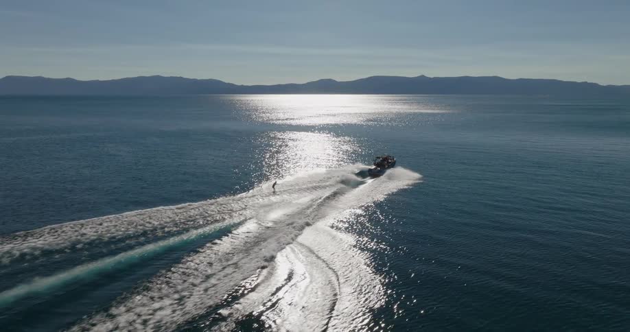A person is water skiing on the lake