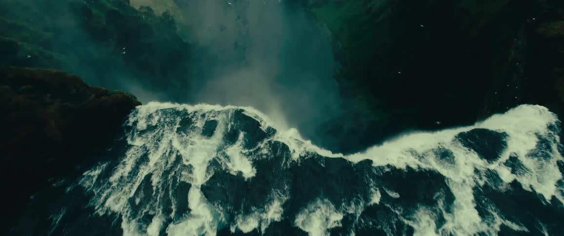 Water cascades down a waterfall