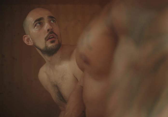 A man is fearful of a muscle bound man