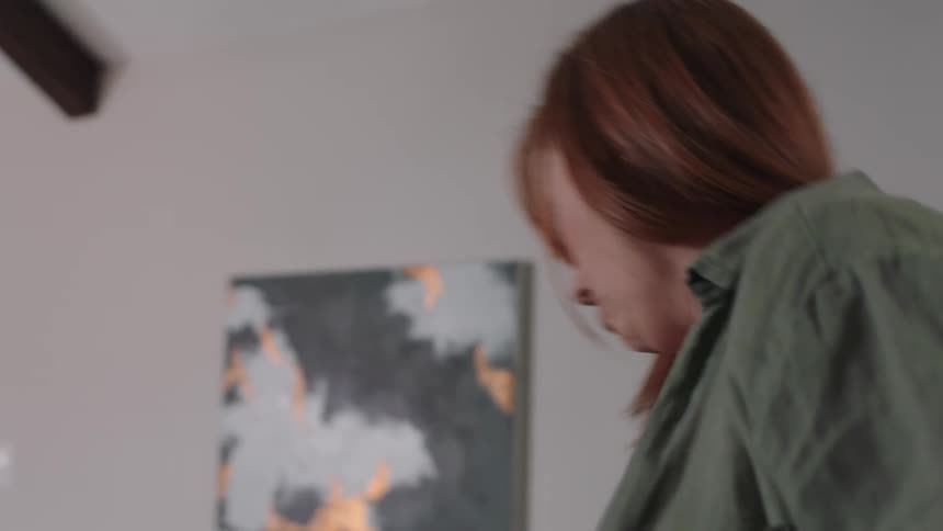 A woman picks up her bag and leaves