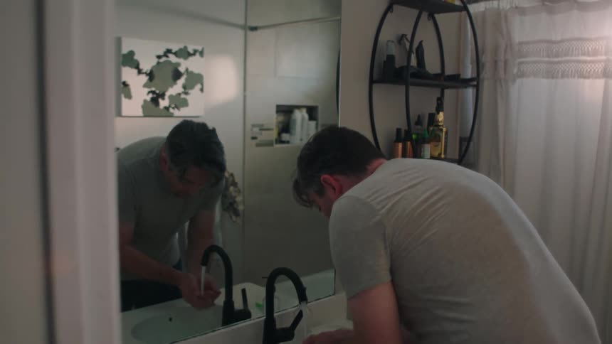 A ma checks his reflection