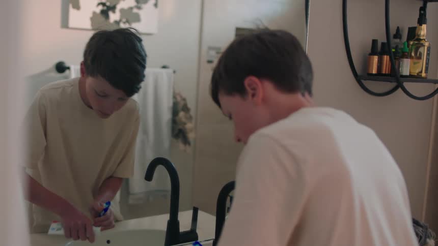 Boy going to the bathroom to brush his teeth