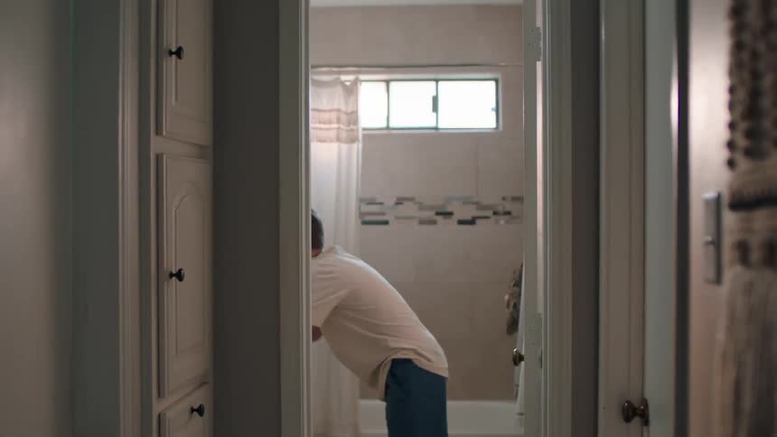 Boy going to the bathroom to wash his face